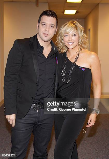 Hosts George Stroumboulopoulos and Cheryl Hickey arrive at the Canada For Haiti Benefit on January 22, 2010 in Toronto, Canada.
