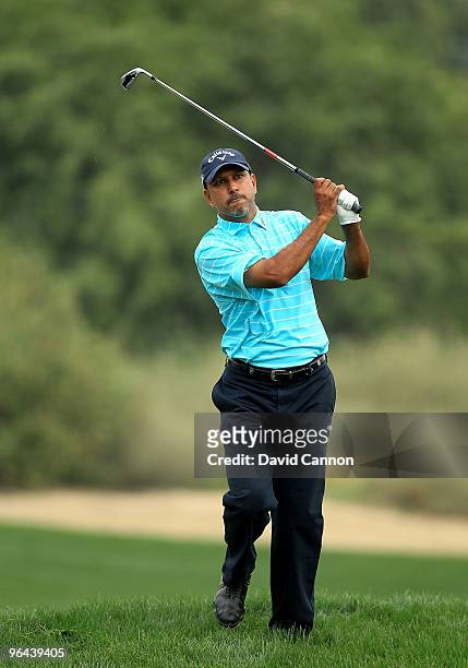 Jeev Milkha Singh of India plays his second shot at the 9th hole during the second round of the 2010 Omega Dubai Desert Classic on the Majilis Course...
