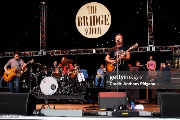 'Two Tone' Tommy, Patrick Hallahan, Jim James and Bo Koster of My Morning Jacket perfom on stage at the Bridge School Benefit Concert 2007 held at...