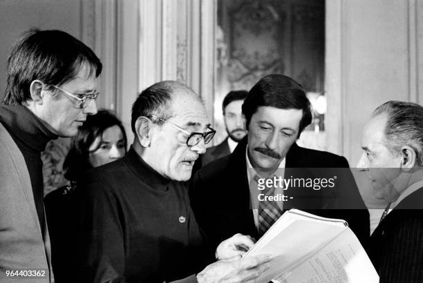 Spanish director Luis Bunuel directs French actors Jean Rochefort and Julien Bertheau during the filming of "The Phantom of Liberty" in 1974.