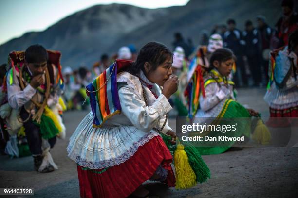 Costumed dancers parade at a chapel on the first day of the annual Qoyllur Rit'i festival on May 27, 2018 in Ocongate, Peru. Every year, since 1783...