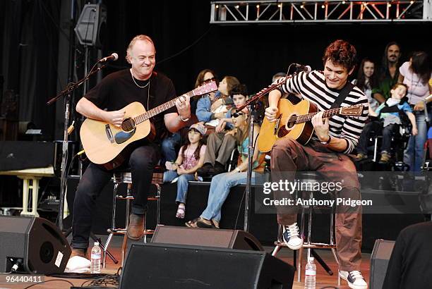 Robbie McIntosh and John Mayer perfom on stage at the Bridge School Benefit Concert 2007 held at the Shoreline Amphitheatre in Mountain View,...