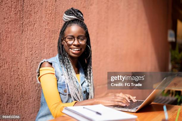 business woman working distance with laptop - dreadlocks-isolated stock pictures, royalty-free photos & images
