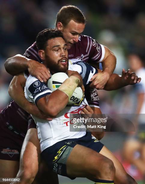 Antonio Winterstein of the Cowboys is tackled during the round 13 NRL match between the Manly Sea Eagles and the North Queensland Cowboys at...