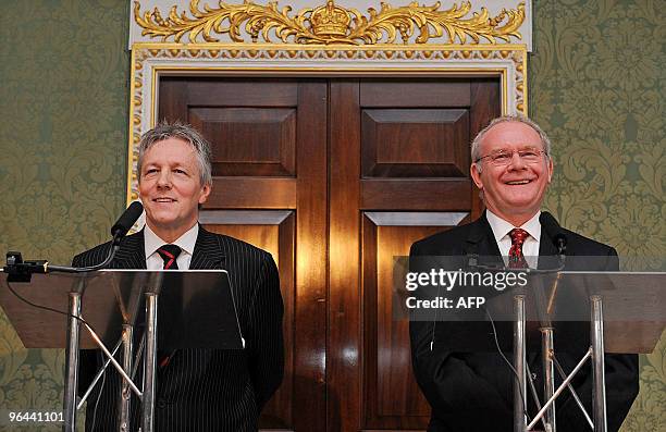 Northern Ireland's First Minister Peter Robinson and Deputy First Minister Martin McGuiness are pictured as they address a press conference with...