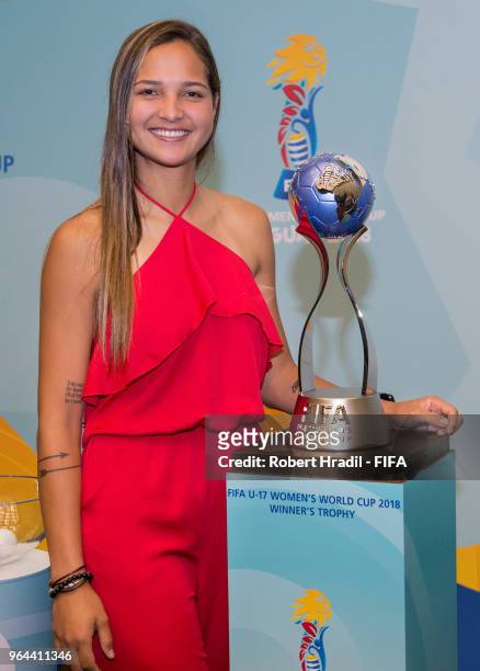 Deyna Castellanos, Official Tournament Ambassador and Venezuelan footballer poses with the trophy before the Official Draw for the FIFA U-17 Women's...