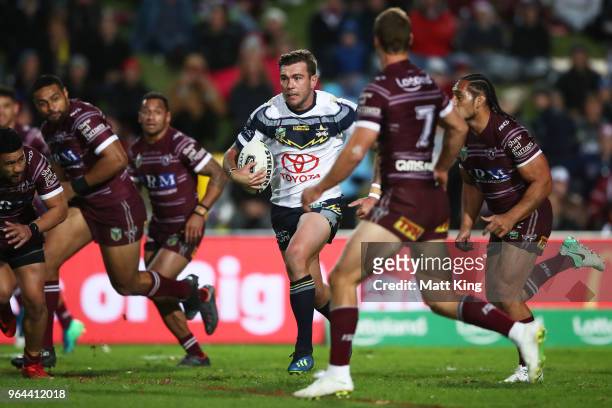 Kyle Feldt of the Cowboys makes a break during the round 13 NRL match between the Manly Sea Eagles and the North Queensland Cowboys at Lottoland on...