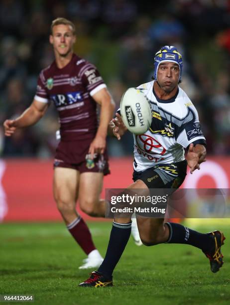 Johnathan Thurston of the Cowboys passes during the round 13 NRL match between the Manly Sea Eagles and the North Queensland Cowboys at Lottoland on...