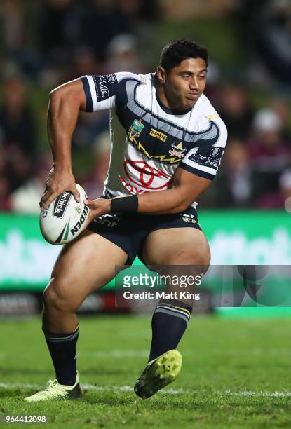 Jason Taumalolo of the Cowboys passes during the round 13 NRL match between the Manly Sea Eagles and the North Queensland Cowboys at Lottoland on May...