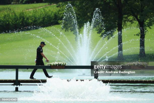 Matt Wallace of England walks across a bridge on the 9th hole during day one of the Italian Open at Gardagolf CC on May 31, 2018 in Brescia, Italy.