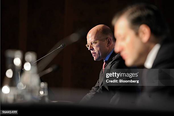 Dieter A. Enkelmann, chief financial officer of Julius Baer, left, speaks at the bank's news conference in Zurich, Switzerland, on Friday, Feb. 5,...