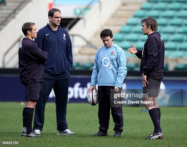 Toby Flood talks to Jonny Wilkinson , England manager Martin Johnson and defence coach Mike Ford during the England training session held at...