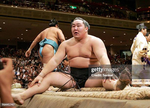 Asashoryu looks dejected after losing against Aminishiki on the day eleven of the Grand Sumo Autumn Tournament at Ryogoku Kokugikan on September 21,...