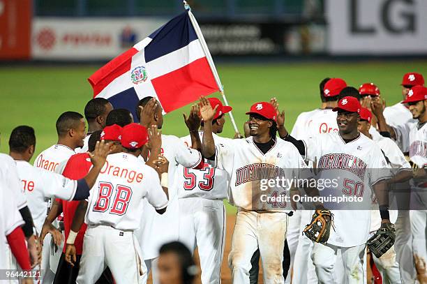 Dominican Republic's Leones del Escogido players celebrate after win a baseball match against Venezuela's Leones del Caracas as part of the Caribbean...