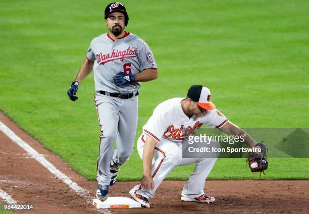 Baltimore Orioles first baseman Chris Davis has Washington Nationals third baseman Anthony Rendon out at first during a MLB game on May 30 between...
