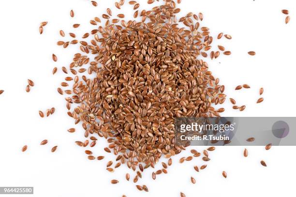 close up of flax seeds isolated on white background - flachs stock-fotos und bilder