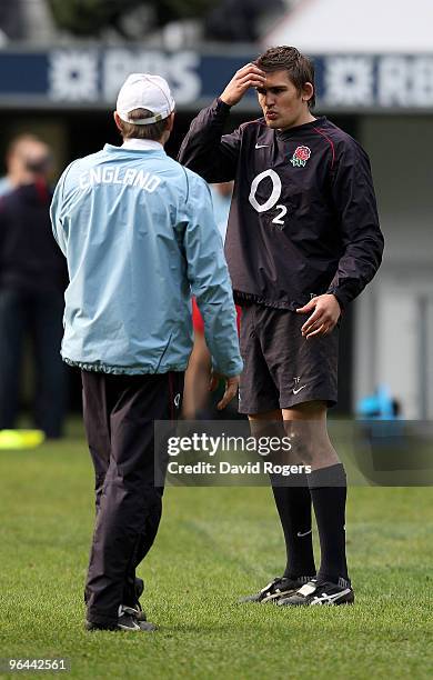 Toby Flood talks to England backs coach Brian Smith during the England training session held at Twickenham Stadium on February 5, 2010 in London,...