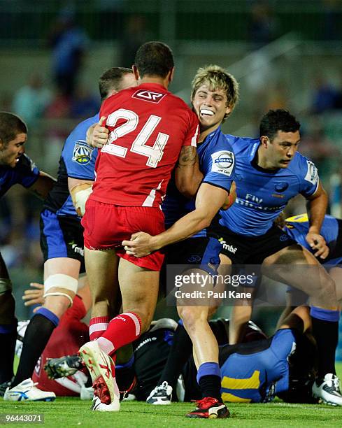 James O'Connor of the Force grapples with Quade Cooper of the Reds during the Super 14 trial match between the Western Force and the Reds at ME...