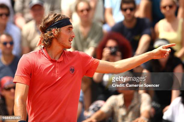 Stefanos Tsitsipas of Greece argues with the umpire during his mens singles second round match against Dominic Thiem of Austria during day five of...