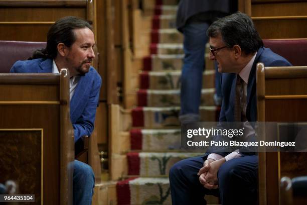 Podemos party leader Pablo Iglesias chats with Basque National Party member Aitor Esteban during a debate on a no-confidence motion at the Lower...