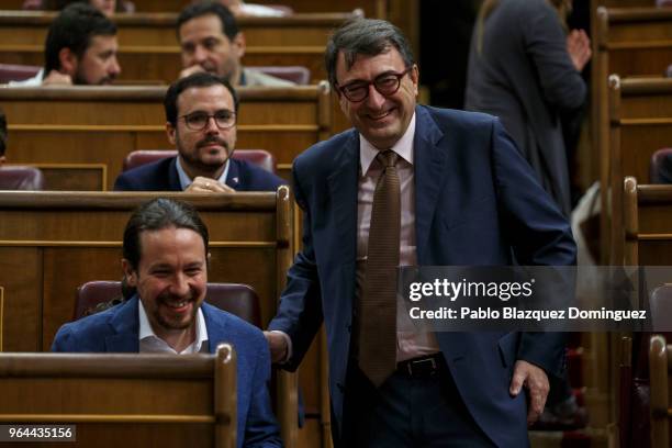 Podemos party leader Pablo Iglesias chats with Basque National Party member Aitor Esteban during a debate on a no-confidence motion at the Lower...