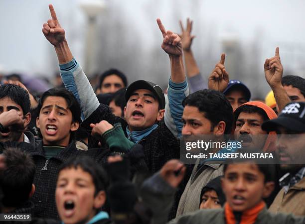 Kashmiris shout anti-India slogans near the body of Zahid Farooq who died on February 5, 2010 after an altercation broke-out between troops and a...