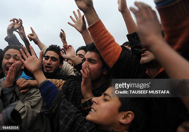 Kashmiris shout anti-India slogans near the body of Zahid Farooq who died on February 5, 2010 after an altercation broke-out between troops and a...