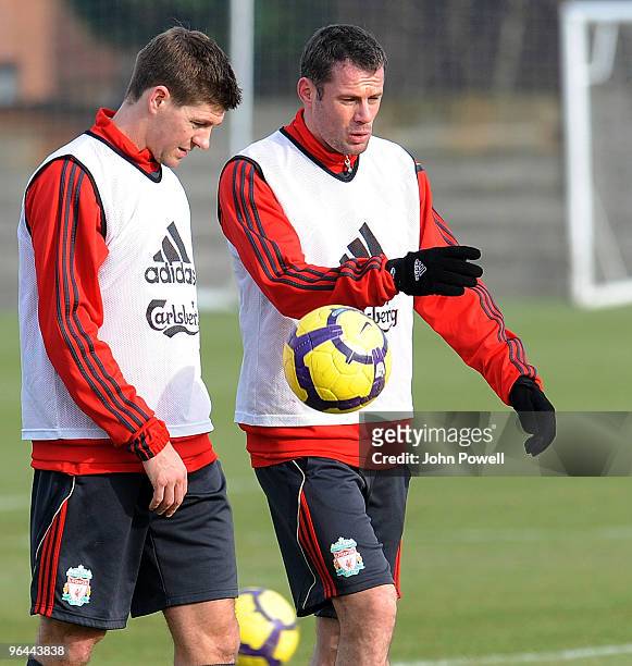 Steven Gerrard talks with Jamie Carragher during a Liverpool FC training session at Melwood Training Ground on February 5, 2010 in Liverpool, England.