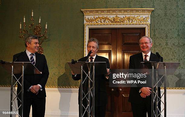 Northern Ireland's First Minister and DUP leader Peter Robinson speaks beside Britain's Prime Minister Gordon Brown and Northern Ireland's Deputy...