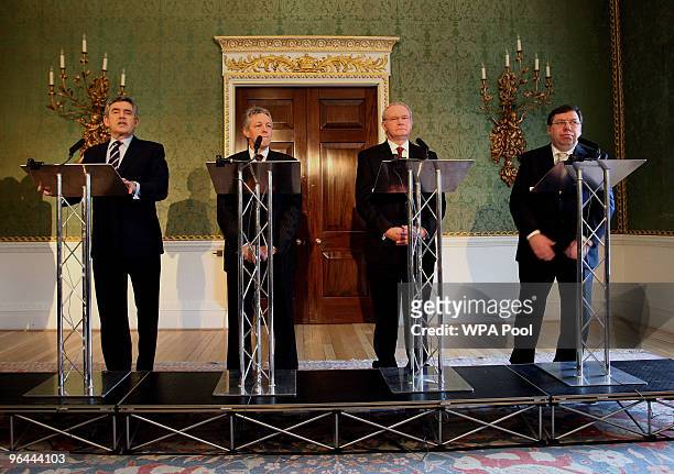 Britain's Prime Minister Gordon Brown speaks beside Northern Ireland's First Minister and DUP leader Peter Robinson, Northern Ireland's Deputy First...