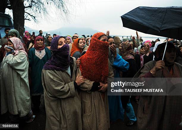 Kashmiris mourn near the body of Zahid Farooq who died on February 5, 2010 after an altercation broke-out between troops and a group of boys in the...