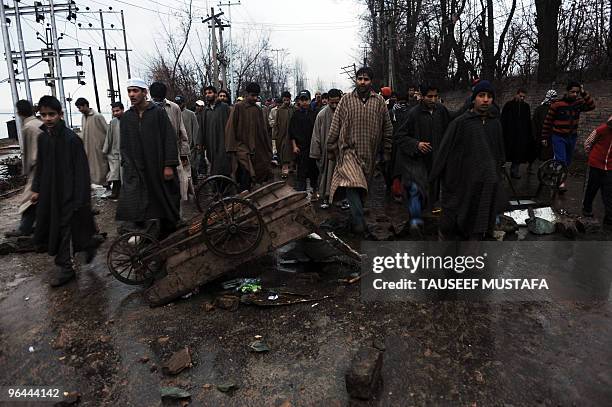 Kashmiris protest near the body of Zahid Farooq who died on February 5, 2010 after an altercation broke-out between troops and a group of boys in the...