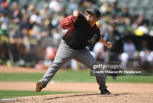 Jorge De La Rosa of the Arizona Diamondbacks pitches against the Oakland Athletics in the bottom of the seventh inning at the Oakland Alameda...