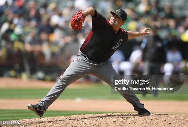 Jorge De La Rosa of the Arizona Diamondbacks pitches against the Oakland Athletics in the bottom of the seventh inning at the Oakland Alameda...