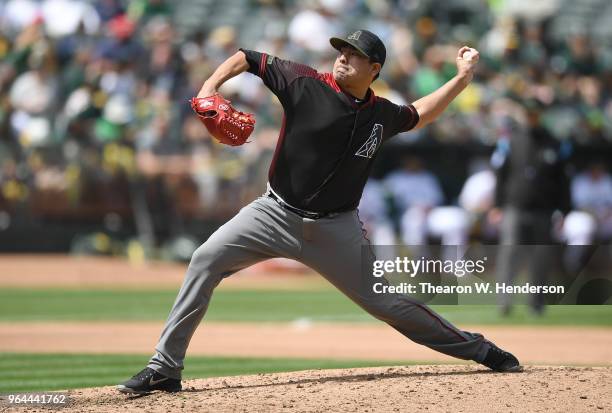 Jorge De La Rosa of the Arizona Diamondbacks pitches against the Oakland Athletics in the bottom of the seventh inning at the Oakland Alameda...