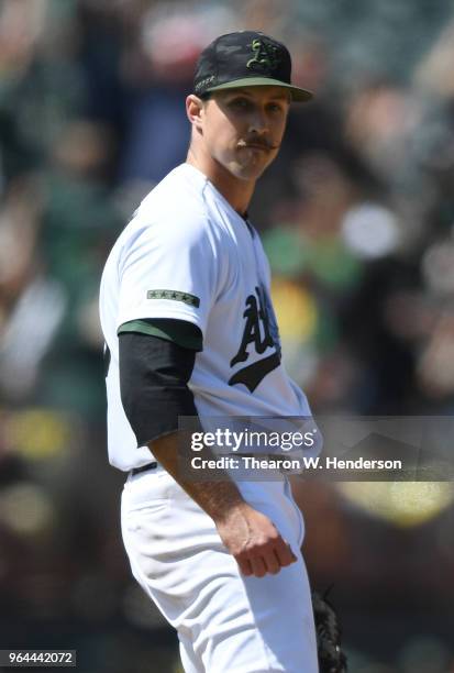 Starting pitcher Daniel Mengden of the Oakland Athletics reacts after the last out of the game was made against the Arizona Diamondbacks in the top...