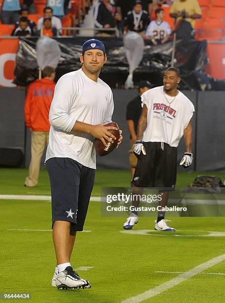 Players Tony Romo and DeSean Jackson practice prior to the 2010 Pro Bowl at Sun Life Stadium on January 31, 2010 in Miami Gardens, Florida.