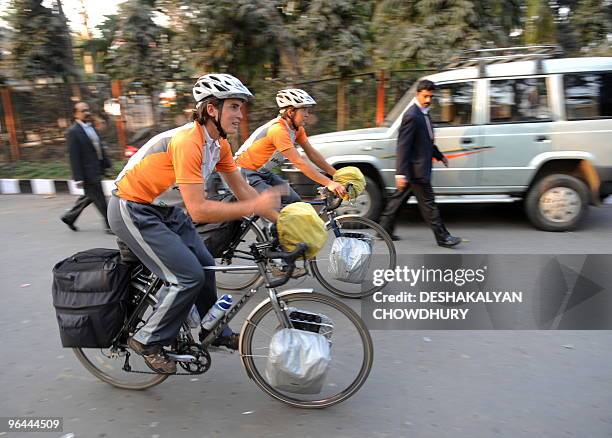 Brothers Jon Wright and Dominique Wright cycle through Kolkata on February 5 as part of their 11,000-mile cycle tour along the Tropic of Cancer to...