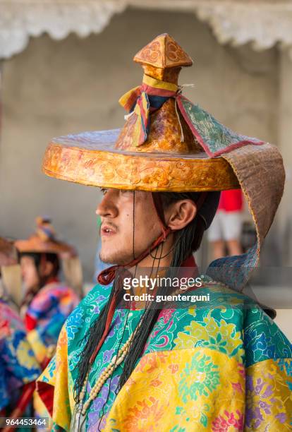 buddhist monk in traditonal costume during monastery festival - ladakh region stock pictures, royalty-free photos & images