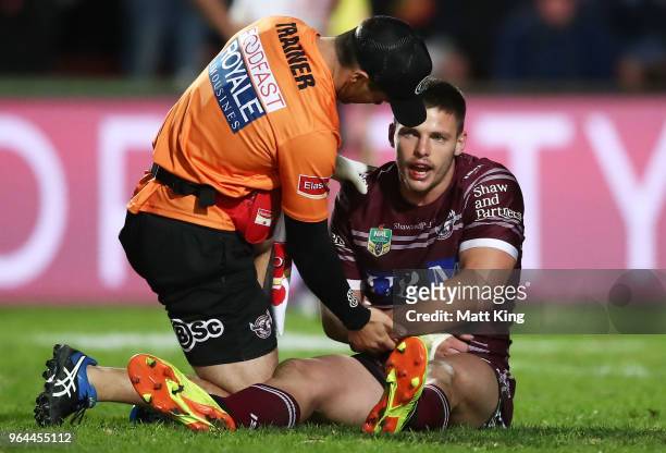 Jack Gosiewski of the Sea Eagles leaves the field with an injury during the round 13 NRL match between the Manly Sea Eagles and the North Queensland...