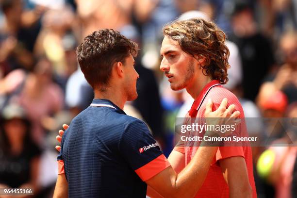 Dominic Thiem of Austria is congratulated on victory in the mens singles second round match against Stefanos Tsitsipas of Greece during day five of...