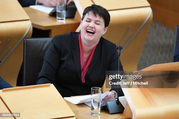 Leader of the Scottish Conservatives Ruth Davidson reacts during first minister's questions in the Scottish Parliament on March 31, 2018 in...