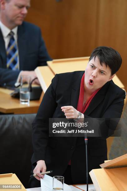 Leader of the Scottish Conservatives Ruth Davidson reacts during first minister's questions in the Scottish Parliament on March 31, 2018 in...