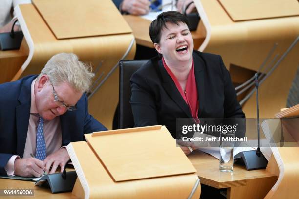 Leader of the Scottish Conservatives Ruth Davidson reacts during first minister's questions in the Scottish Parliament on March 31, 2018 in...