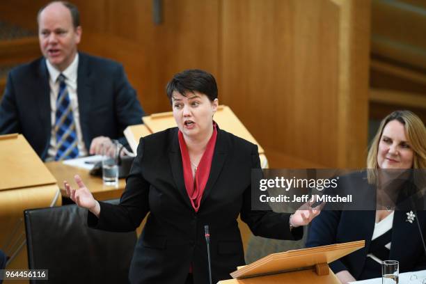 Leader of the Scottish Conservatives Ruth Davidson reacts during first minister's questions in the Scottish Parliament on March 31, 2018 in...