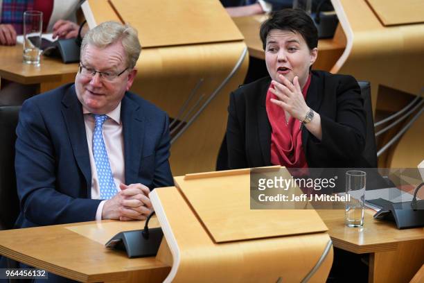 Leader of the Scottish Conservatives Ruth Davidson reacts during first minister's questions in the Scottish Parliament on March 31, 2018 in...