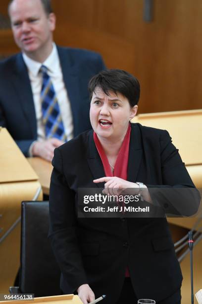 Leader of the Scottish Conservatives Ruth Davidson reacts during first minister's questions in the Scottish Parliament on March 31, 2018 in...