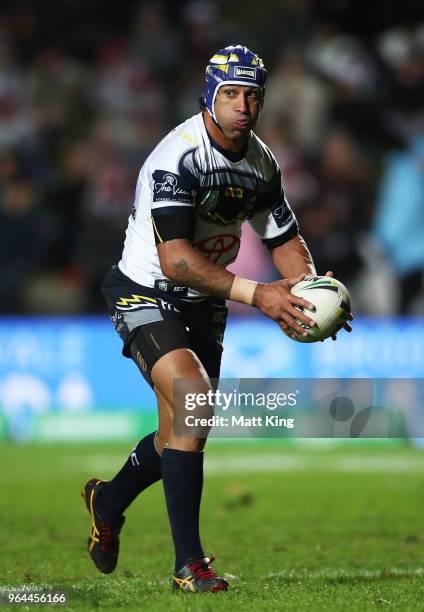 Johnathan Thurston of the Cowboys runs with the ball during the round 13 NRL match between the Manly Sea Eagles and the North Queensland Cowboys at...