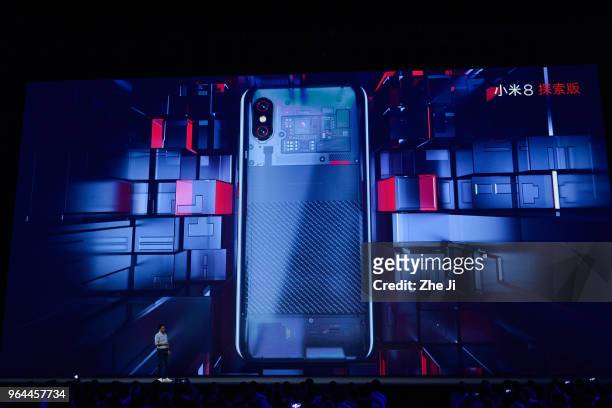 Lei Jun, chief executive officer of Xiaomi Corp., presents the company's Mi 8 Explor Editon smartphone during the Xiaomi Launches Its Flagship...