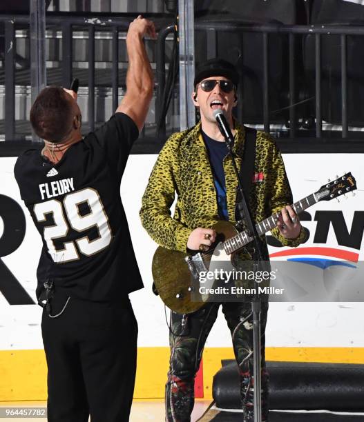 Frontman Dan Reynolds and bassist Ben McKee of Imagine Dragons perform before Game Two of the 2018 NHL Stanley Cup Final at T-Mobile Arena between...